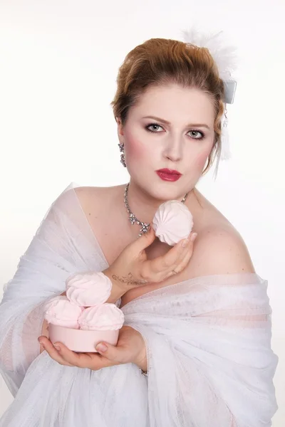 Plus size woman eats sweets with a pleasur — Stock Photo, Image